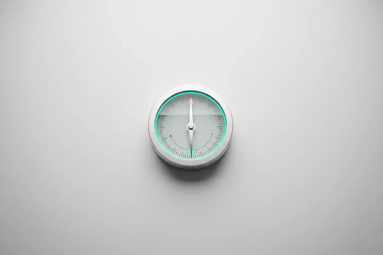 Minimalist metal compass on soft background, needle pivoting from faded old direction to a glowing new heading.